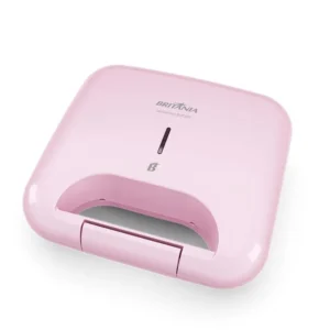 Sanduicheira Britânia BGR05RS rosa com design compacto e acabamento retrô, ideal para preparo rápido de lanches.